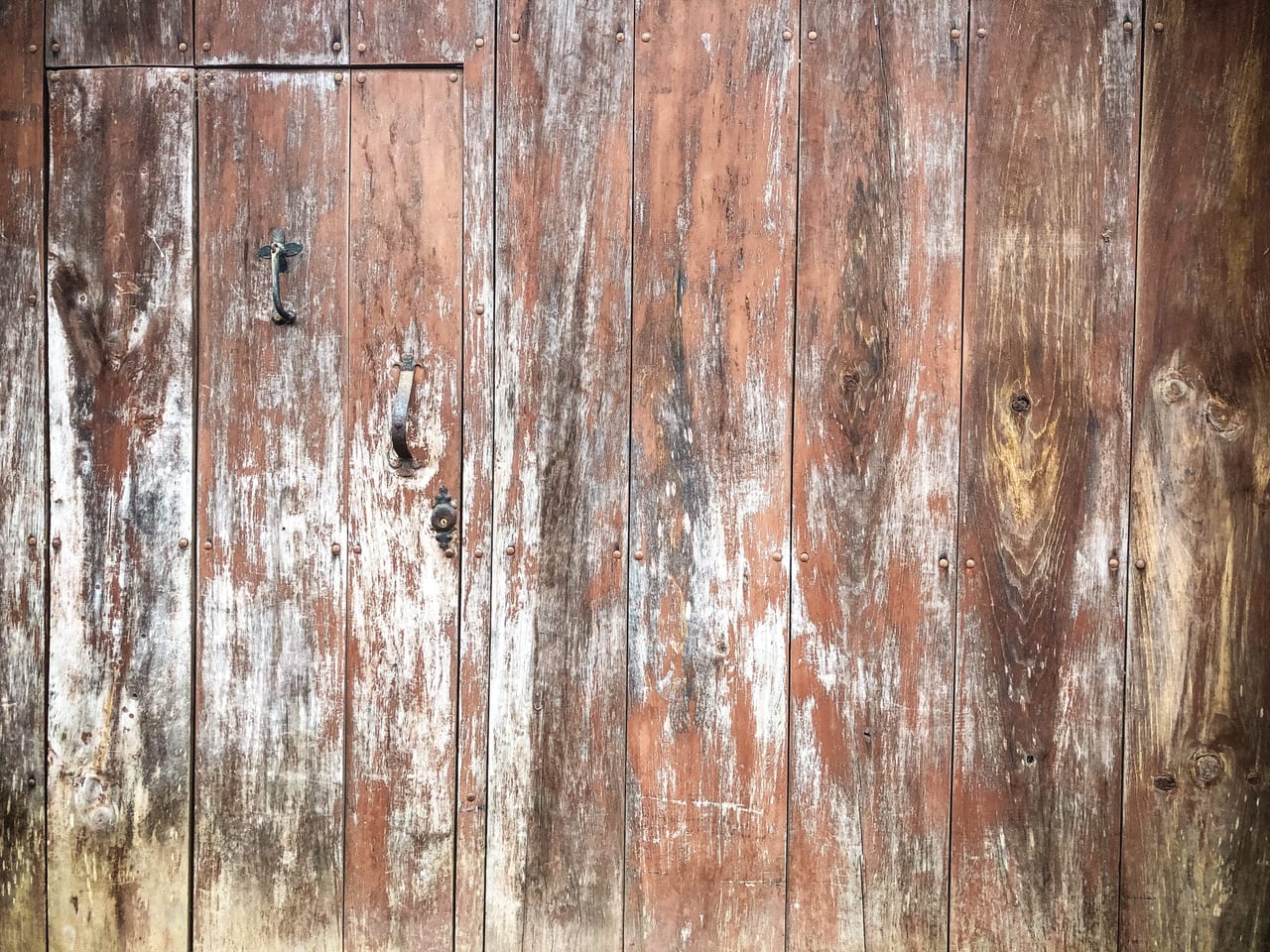 Weathered wooden planks of an old door