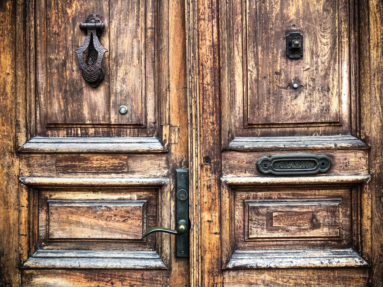 Carved wooden doors with iron knockers